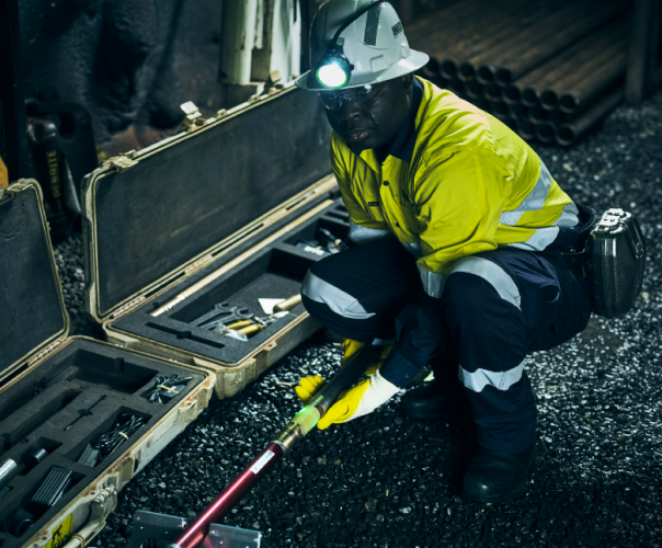 underground mine worker in a protective suit and helmet